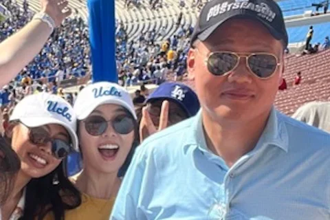 Lee Lab members wearing UCLA attire at a game.