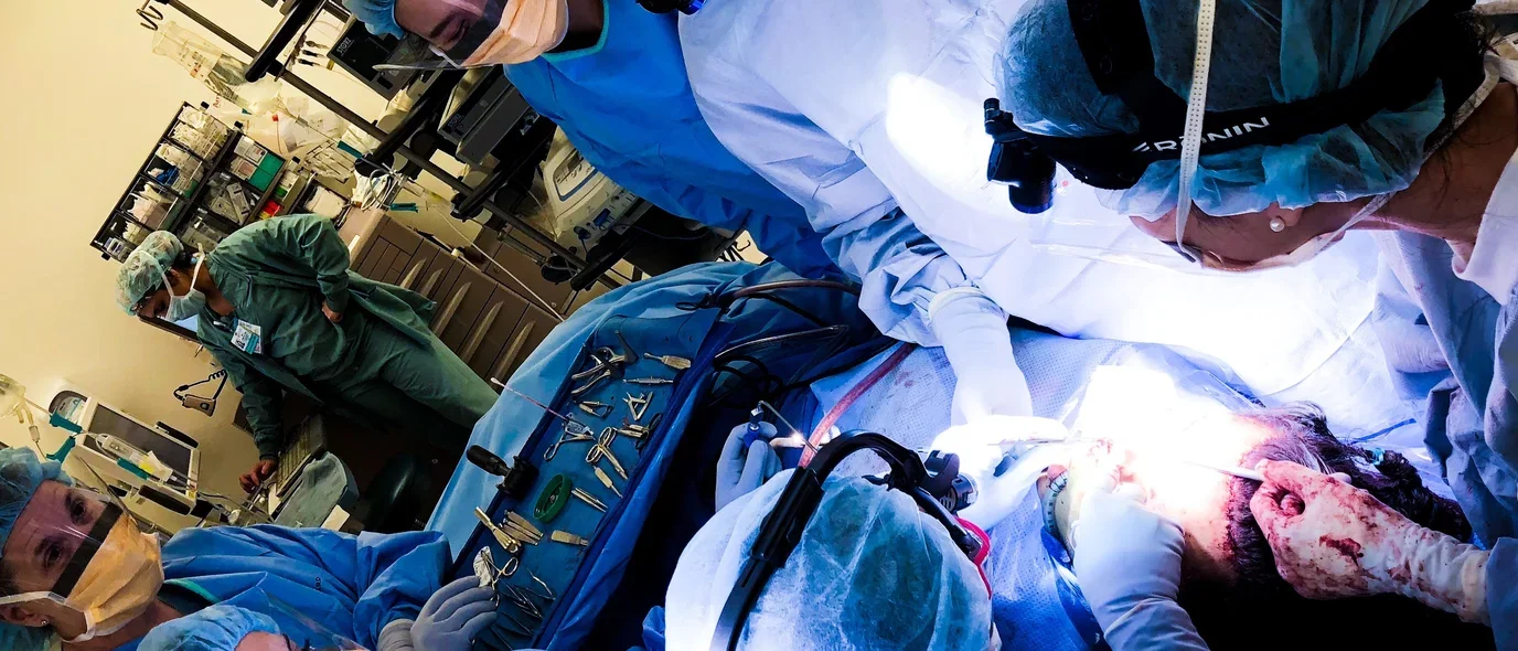 Dr. Justine Lee (far right) and colleagues performing gender-affirming facial feminization surgery at UCLA.